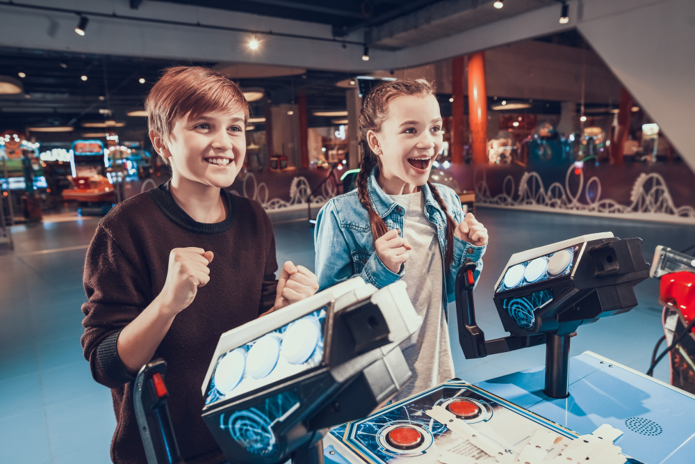 kids piloting blue spacecrafts playing arcade