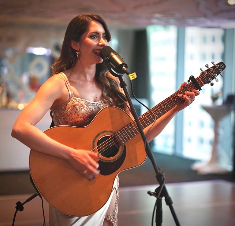 Jessica Allossery, vocalist and guitarist, performing live